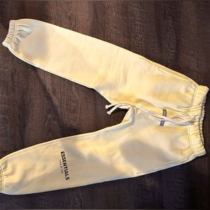 Kids yellow essentials sweatpants.